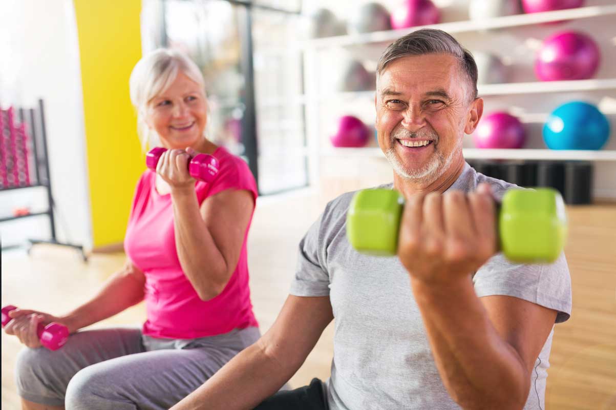Image of man and woman lifting weights Image of man and woman lifting weights