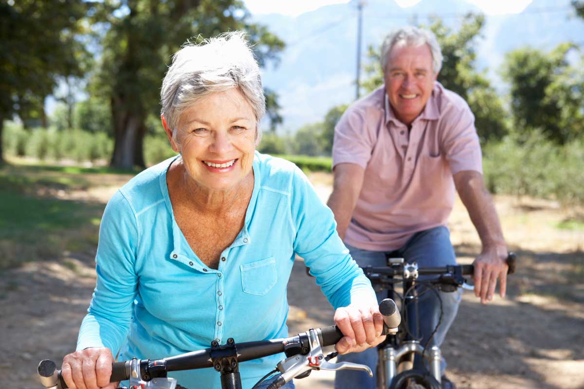 Image of woman and man bicycling Image of woman and man bicycling